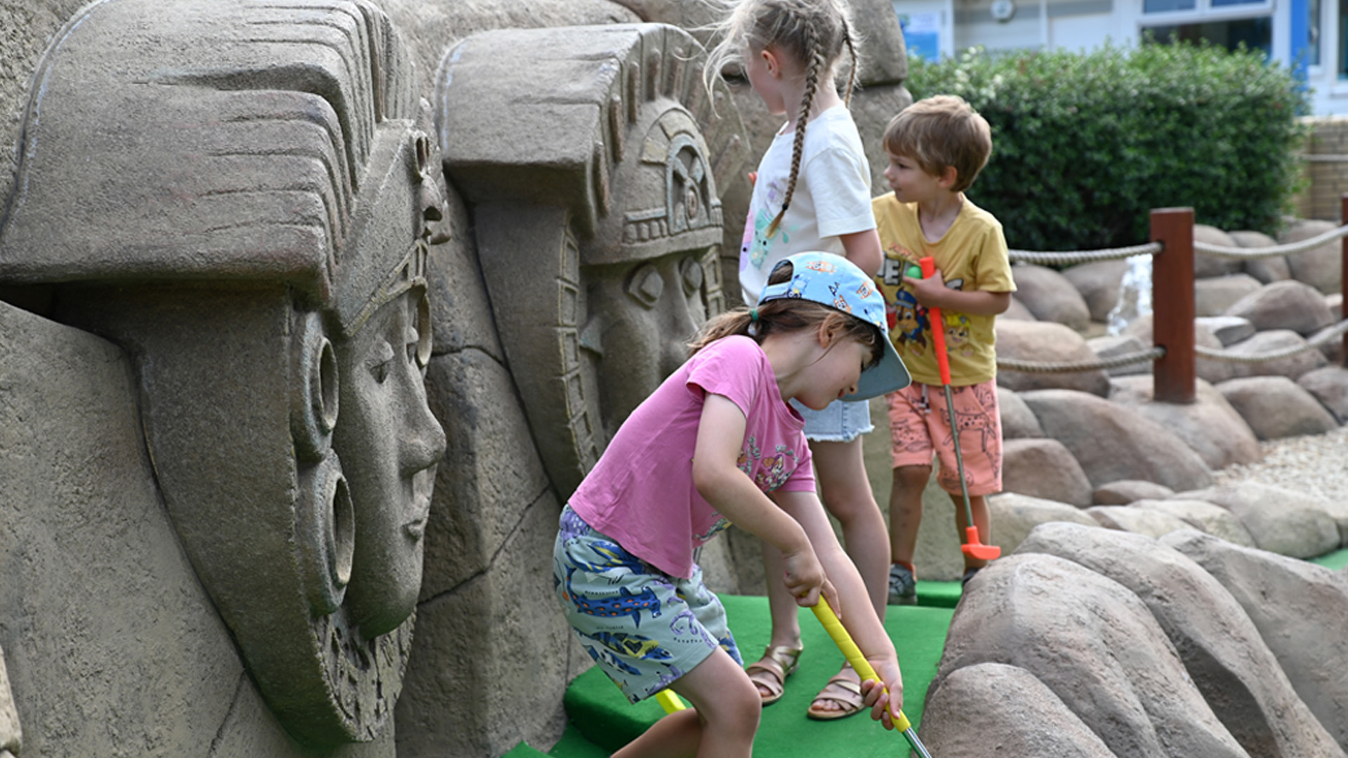young family on the adventure golf course